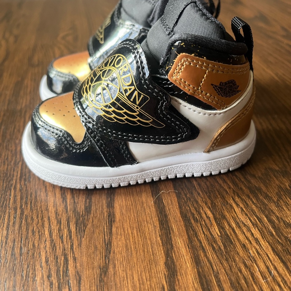 Air Jordan (Sky Jordan) size 4 C Sneakers in Black, Gold, and White NWOT
